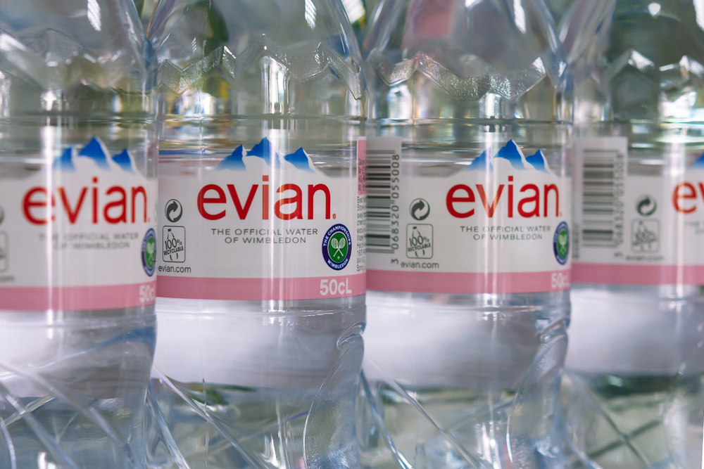 Burgas, Bulgaria - JUNE 16, 2019: Evian is a brand of mineral water made in France on the south shore of Lake Geneva owned by multinational corporation Danone