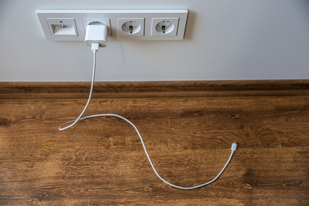 unplugged phone charger left unsafely
