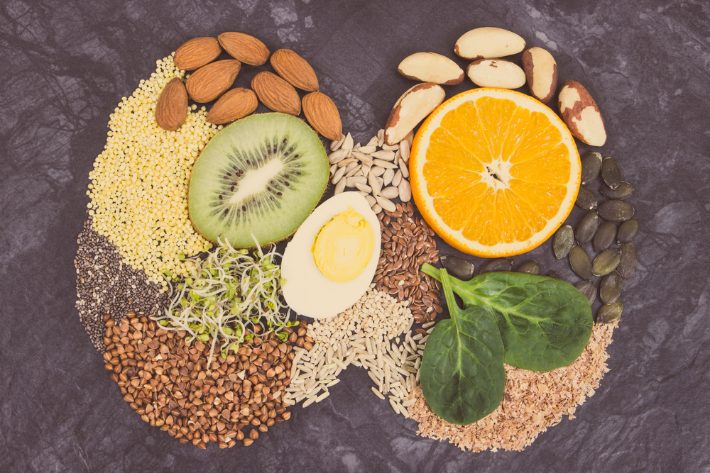 Nutritious natural ingredients in shape of thyroid. Healthy food containing vitamins and minerals. Problems with thyroid concept