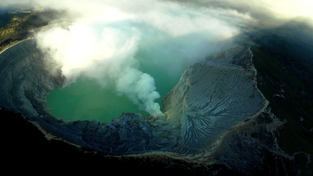 An aerian photo inside a big volcano which is erupting