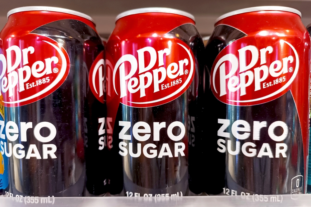 DUSHANBE, TAJIKISTAN - AUGUST 12, 2022: Red and black Dr.Pepper Zero Sugar carbonated soda cans on shop display close up