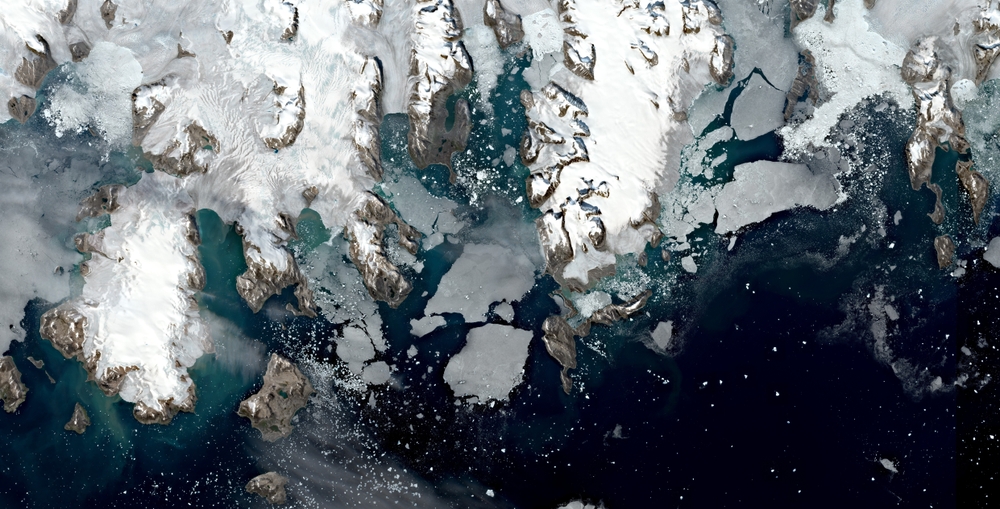 Satellite image of melting glaciers at the coast of Greenland. Contains modified Copernicus Sentinel data 2019.