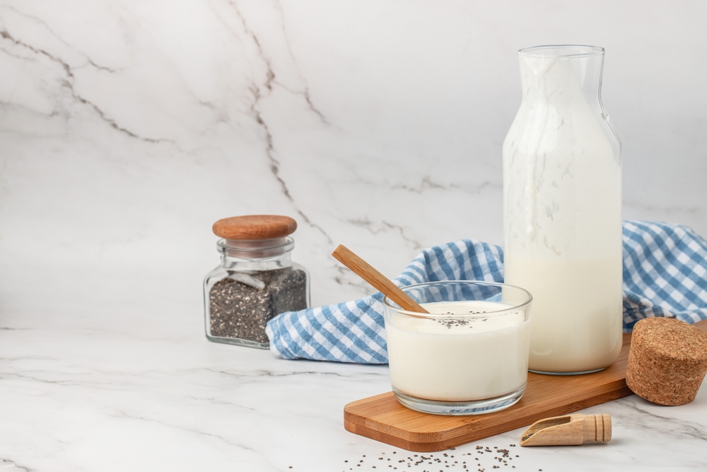 A bottle of milk and glass of yogurt, kefir, fermented milk, Probiotic cold fermented dairy drink. top view,
