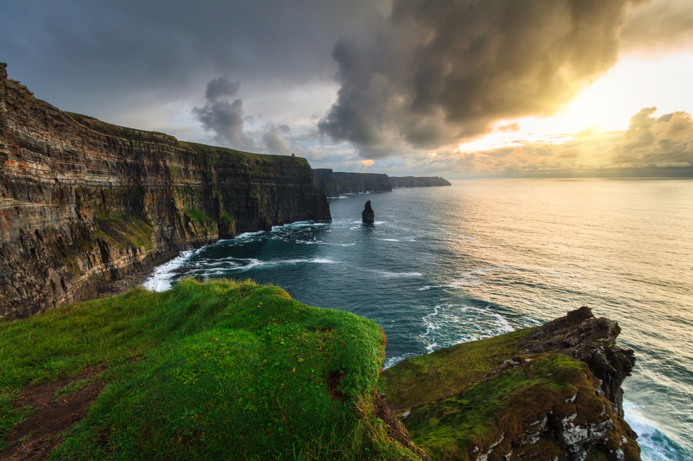 Cliffs of Moher above the Atlantic Ocean at sunset, Ireland.