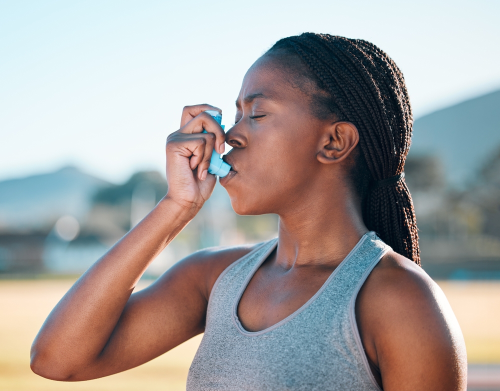 Health, black woman and asthma inhaler, fitness and medicine with wellness, lungs and runner outdoor. Sports, breathing and exercise with workout, help with oxygen and respiratory illness with pump
