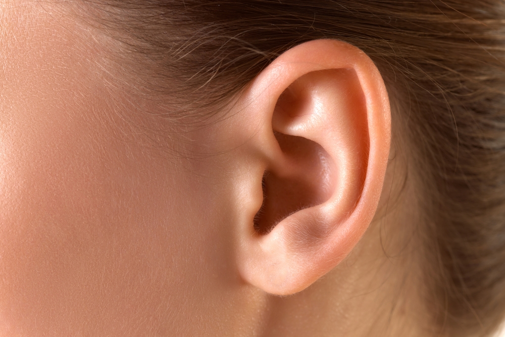 Close-up image of female ear. Taking care after health, visiting doctors, check up. Concept of female beauty, skin care, cosmetology and cosmetics, health, ad