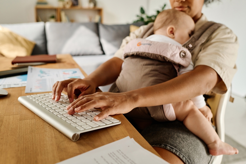 Woman working at home during maternity leave