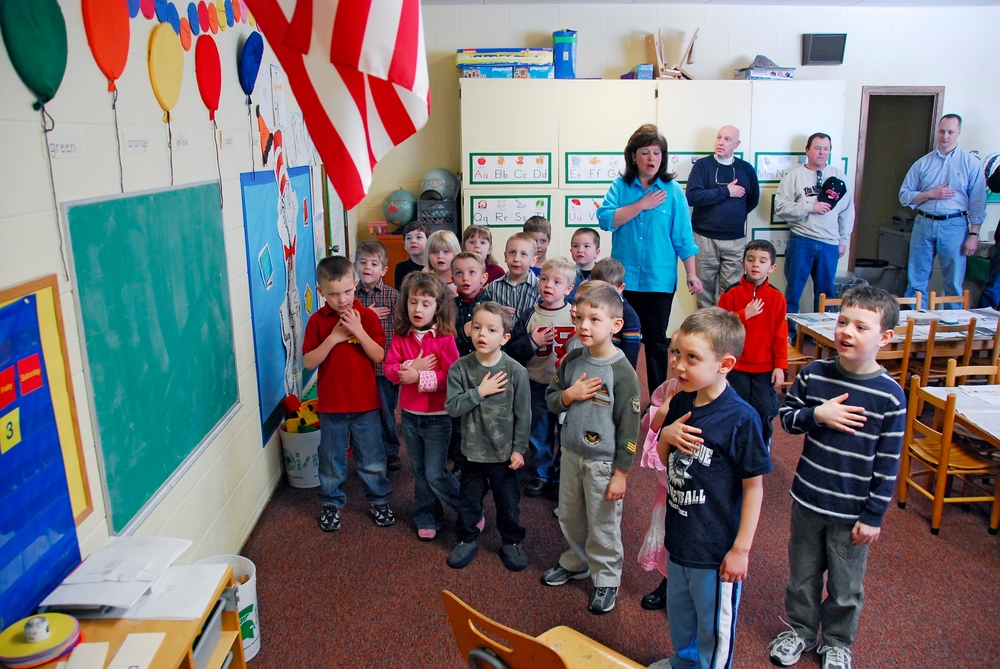Children say pledge of allegiance to the American flag in pre nursery school. created 05.12.2023