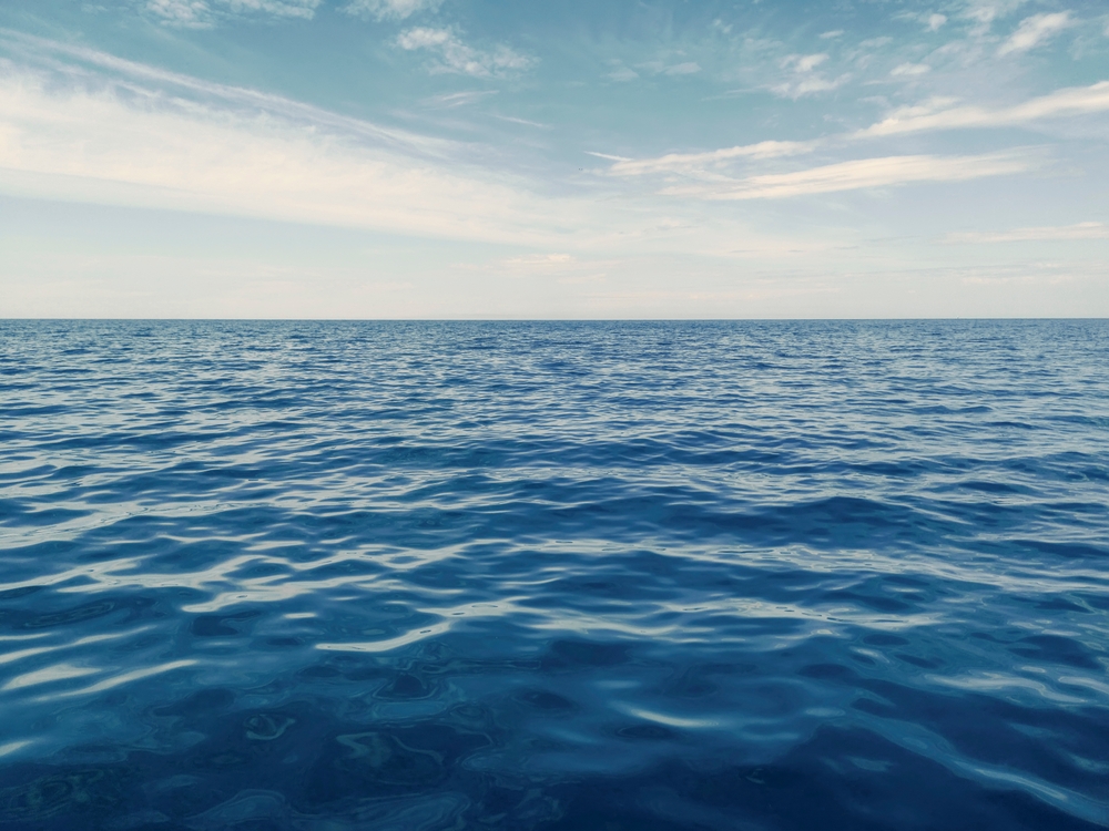 Blue Ocean, Water Surface and Blue Sky