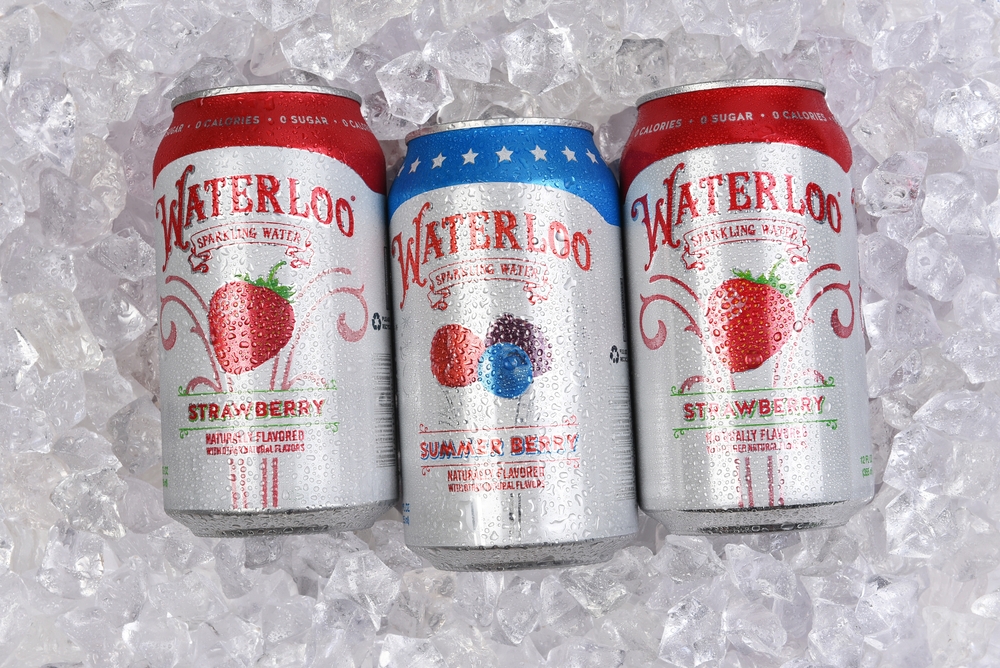 IRVINE, CALIFORNIA - 6 SEPT 2024: Cans of Waterloo Sparkling Water on a bed of ice, Strawberry and Summer Berry Flavored.