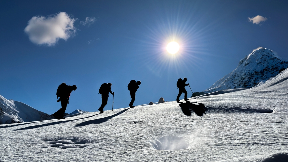 wonderful hiking and sports team in the magnificent atmosphere of the snowy mountains