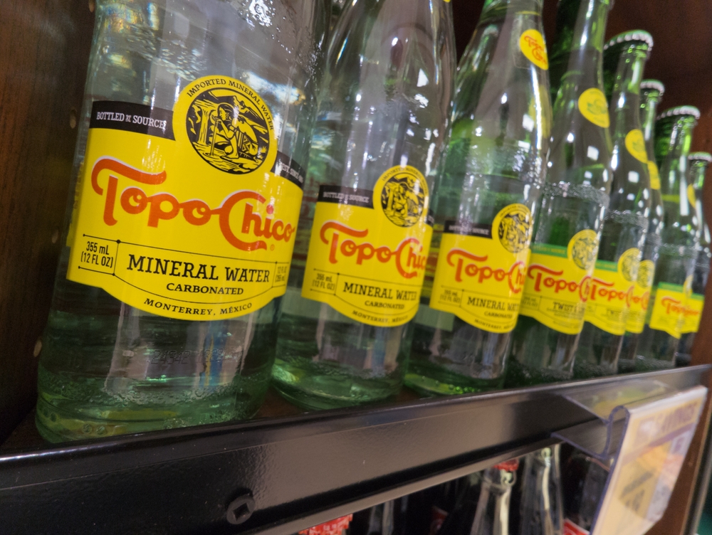 Apex, North Carolina - March 31 2025: Bottles of Topo Chico Mineral Water Brand Products on Store Shelf at Harris Teeter