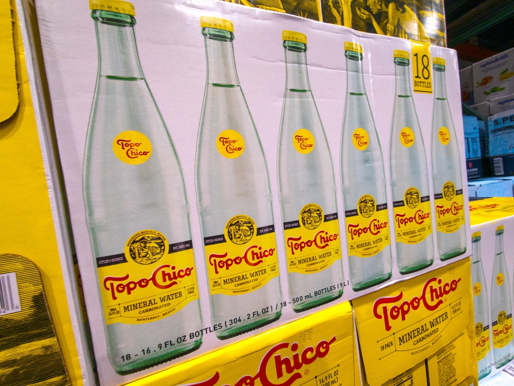 Apex, North Carolina - June 13 2025: Cases of Bottled Topo Chico Mineral Water Product Beverage on Shelf at Costco