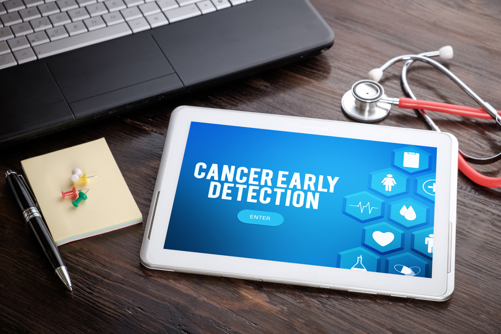 CANCER EARLY DETECTION on screen tablet pc, health concept. Information technology and mobile application in healthcare/medical.