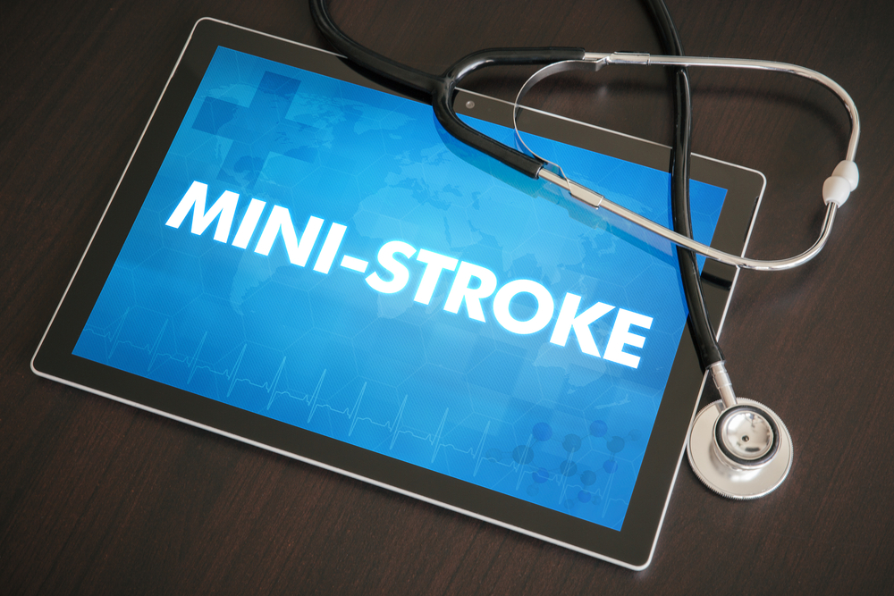 Mini-stroke (neurological disorder) diagnosis medical concept on tablet screen with stethoscope.