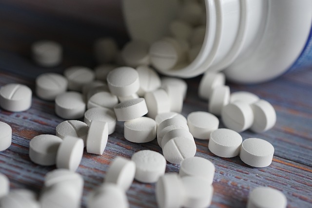 tablets silling out of a container