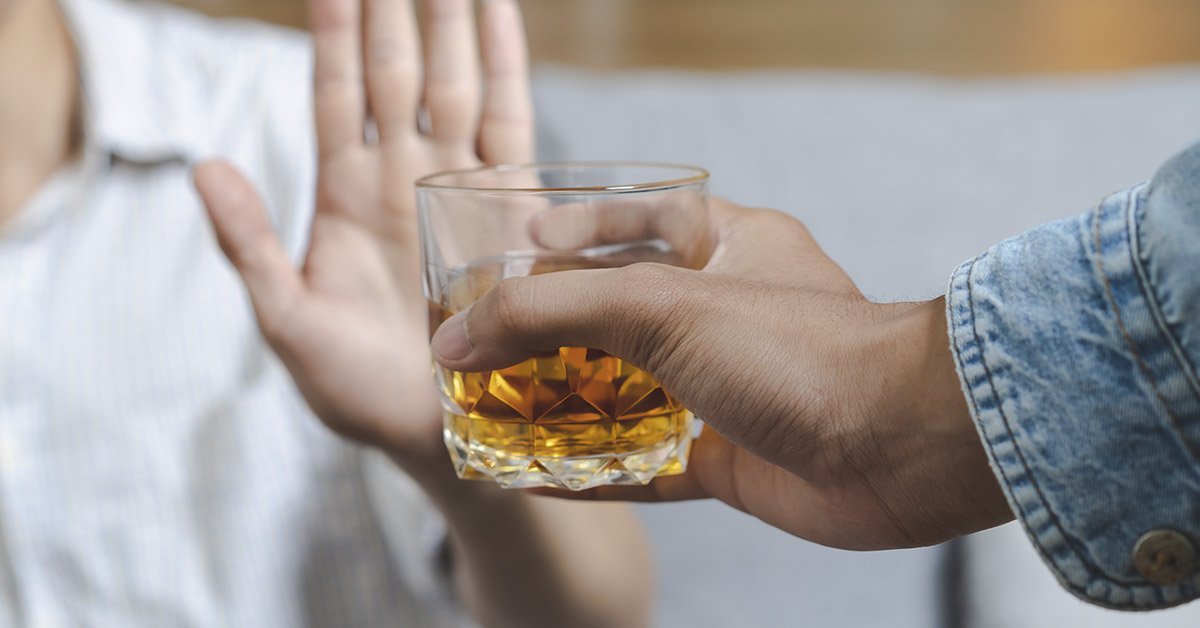 person rejecting an offer of an alcoholic drink. Sober concept