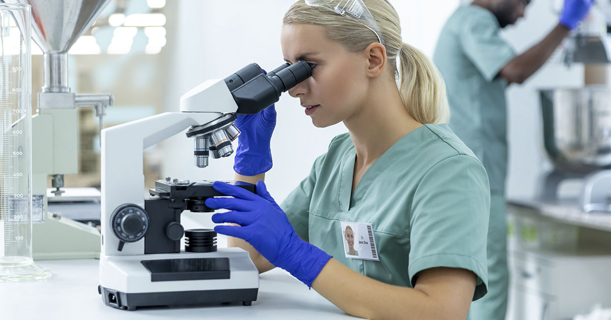 health professional or scientists using microscope