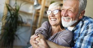 This Country Is Becoming a Top Retirement Spot for Americans elderly couple embracing. Retirement concept