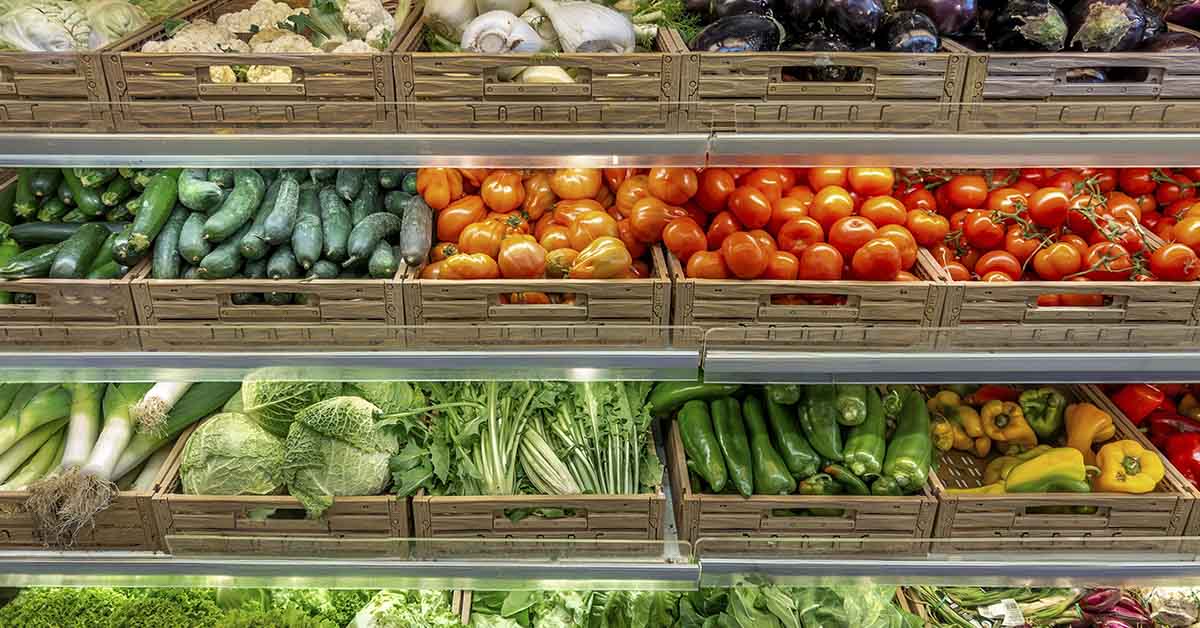 various types of produce in a grocery store setting