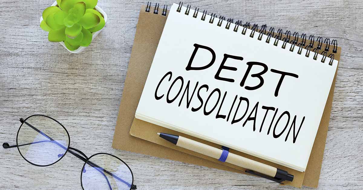 note book with large print reading Debt Consolidation