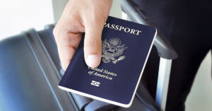 16 Countries That Are Avoiding Visitors From the U.S. person holding a US passport