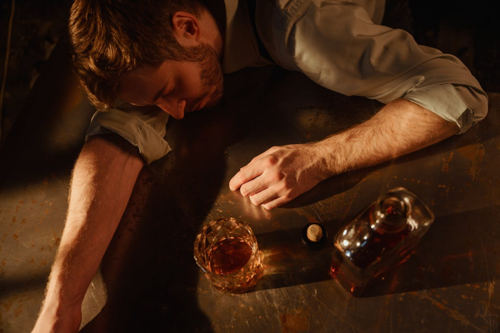 Man in Shirt Sleeping After Drinking Whiskey 
