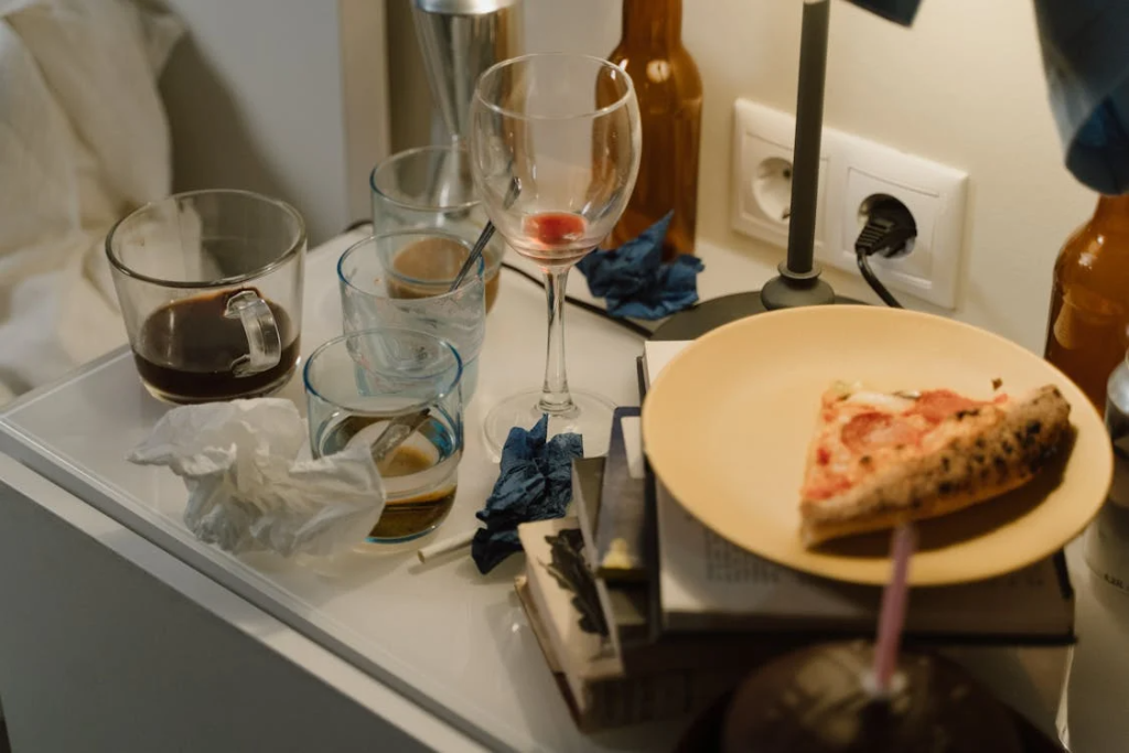 Dirty Glasses and Plates by the Sink 