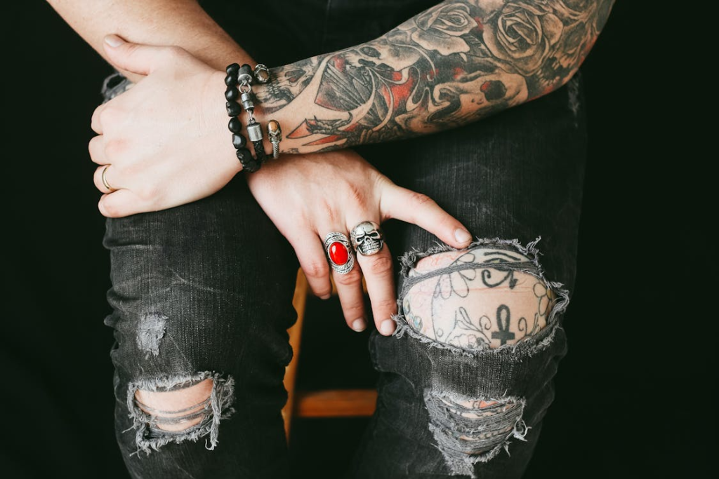 Photo Of Person Wearing Ripped Jeans
