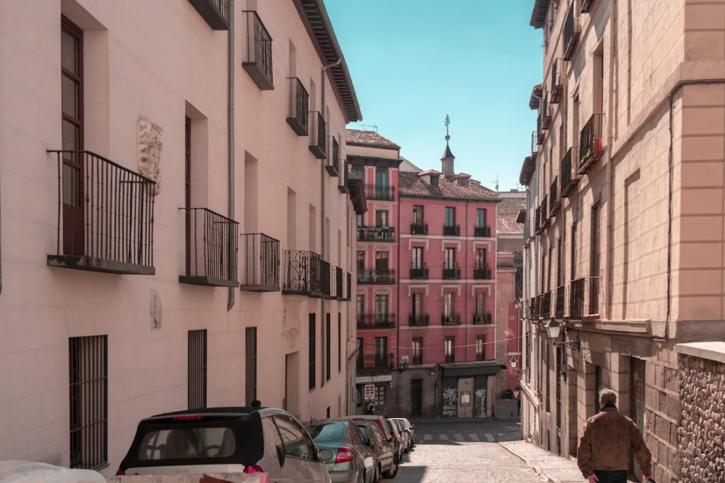 Vehicles Parked Beside Buildings
