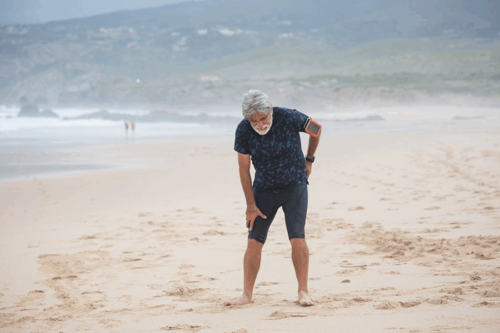 Older man suffering from back pain sciatica
