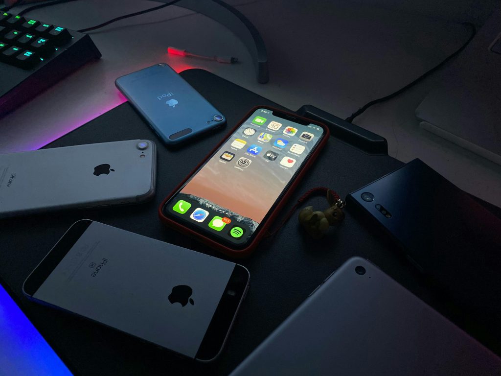 Collection of Apple Devices in Dim Lighting
