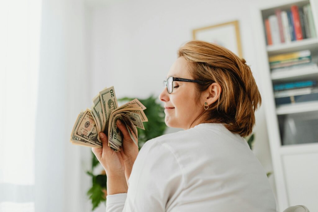 A Woman Holding Money 