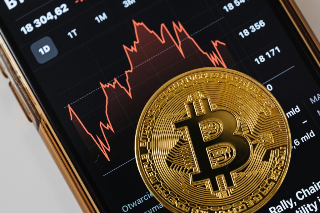 gold bitcoin phone on phone screen