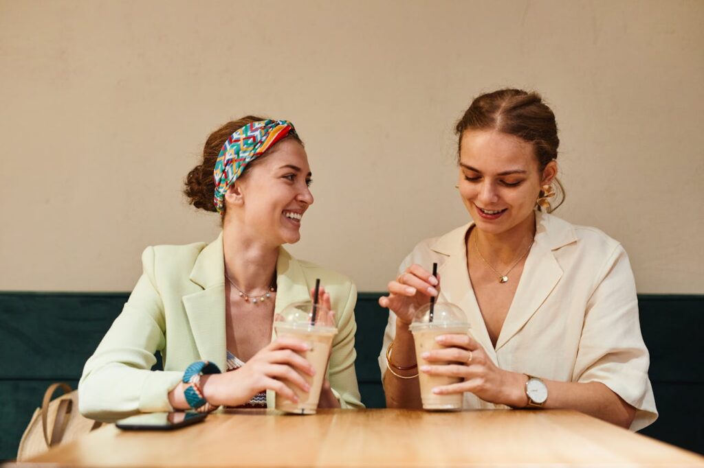 Women Holding Iced Coffee