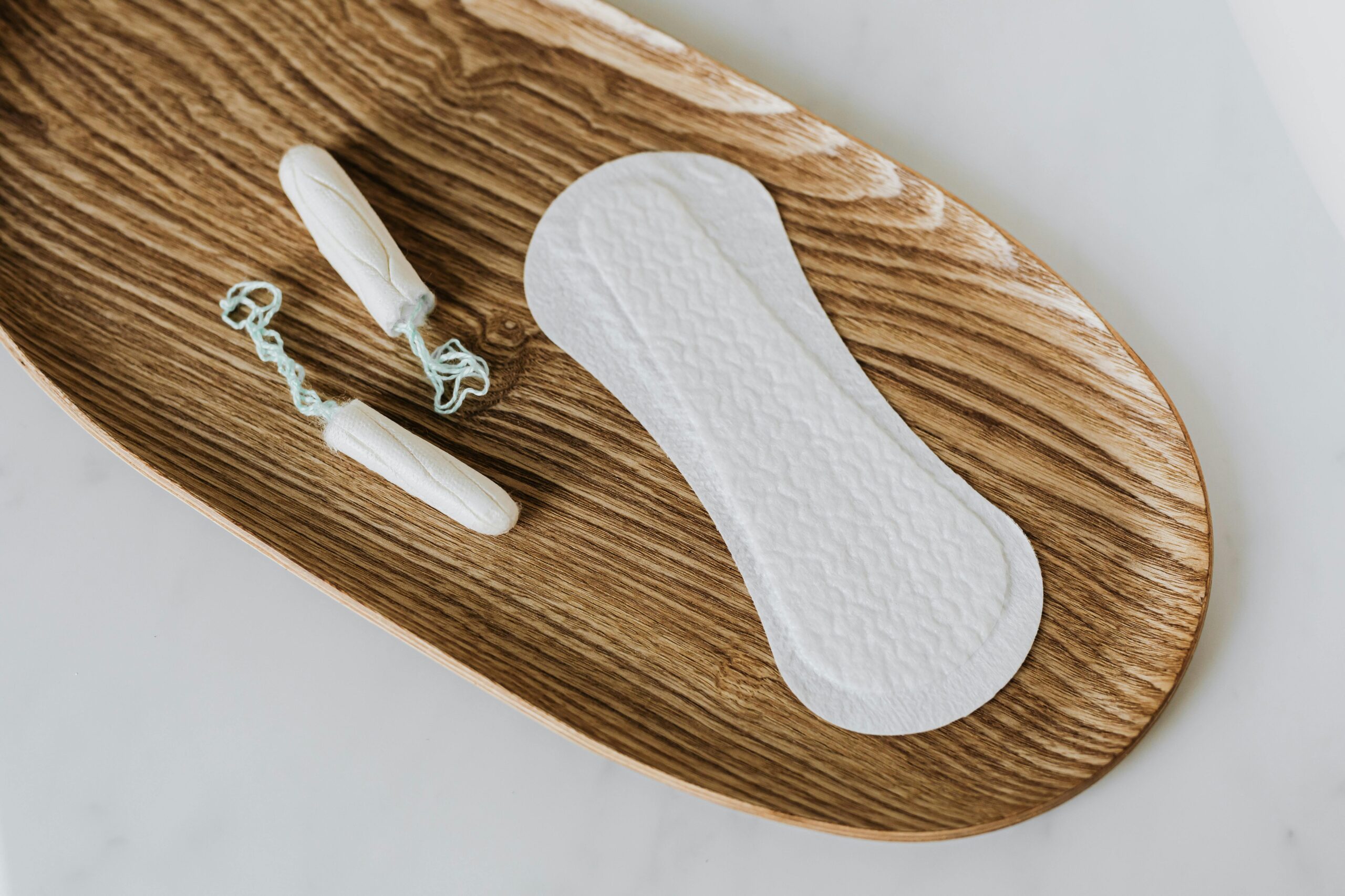 Products of personal hygiene for women on wooden stand
