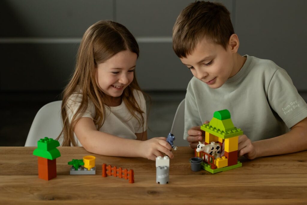 Children Playing with Colorful Building Blocks
