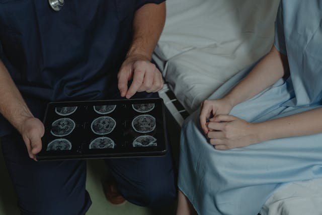 doctor showing scans to patient