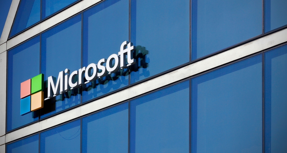 Milan, Italy, June 1, 2024: Microsoft sign on the Microsoft House, the headquarters of Microsoft Italy based in Milan. Close up shot of the Microsoft sign on a modern glass office building in Milan.