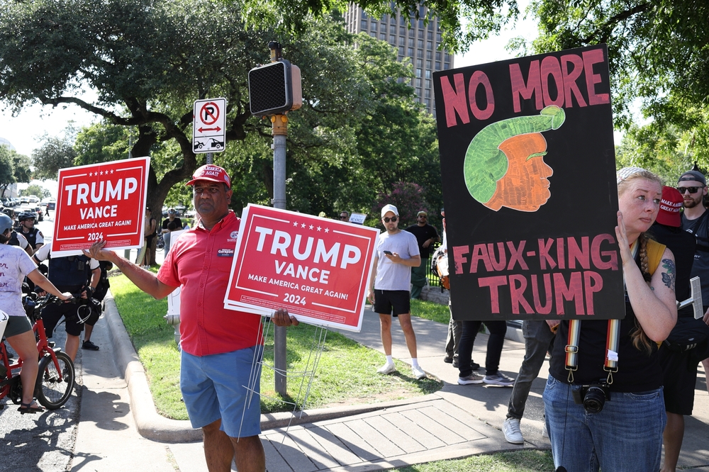 Austin, Texas – 14 June 2025 an interesting but peaceful juxtaposition between a Trump supporter and a liberal woman