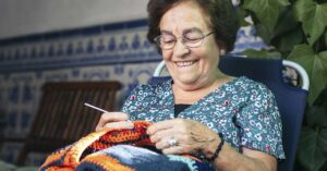 Grandmotherly type woman knitting