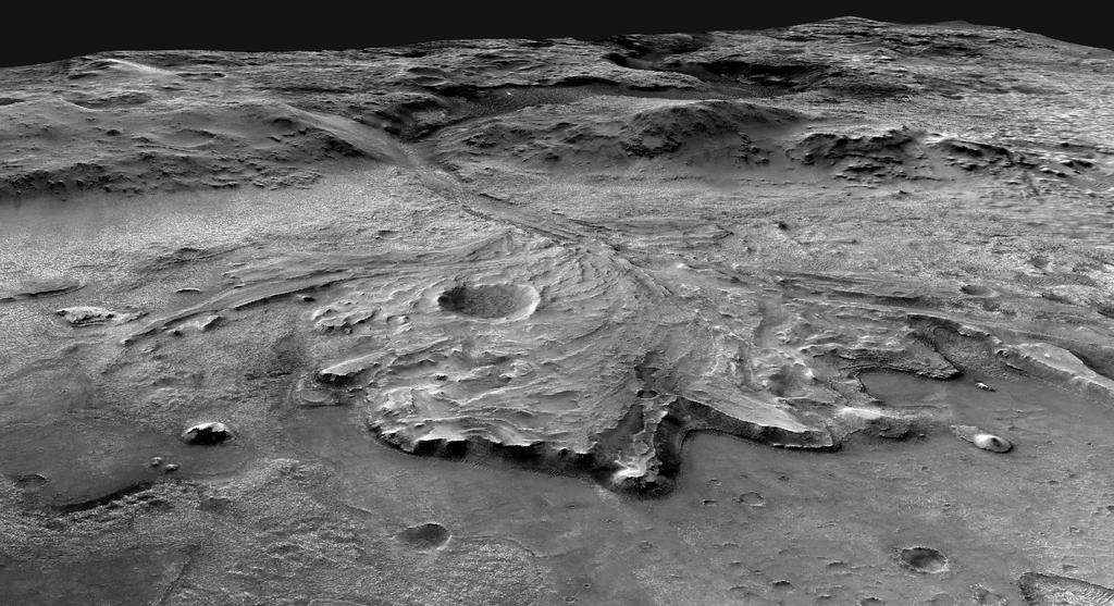Aerial rendering of Jezero Crater showing Perseverance rover's field site with layered rock formations, ancient lake bed terrain, and geological features across the 28-mile-wide crater where the rover searches for signs of past life.