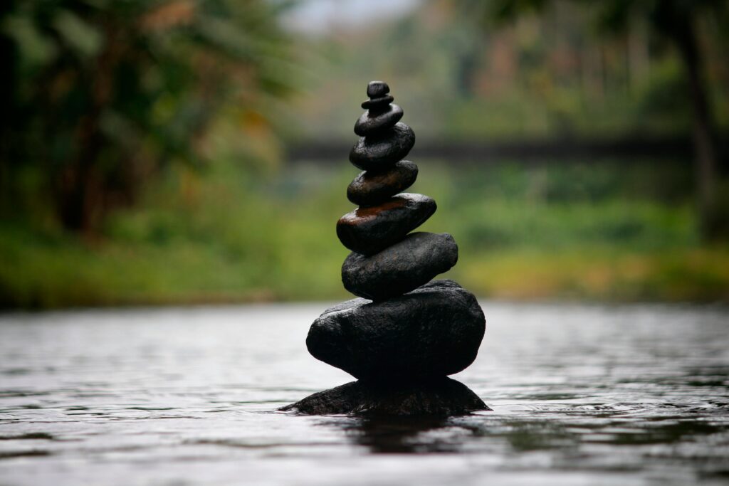 Balanced stone stack representing the question of whether Feng Shui is real or simply traditional belief.