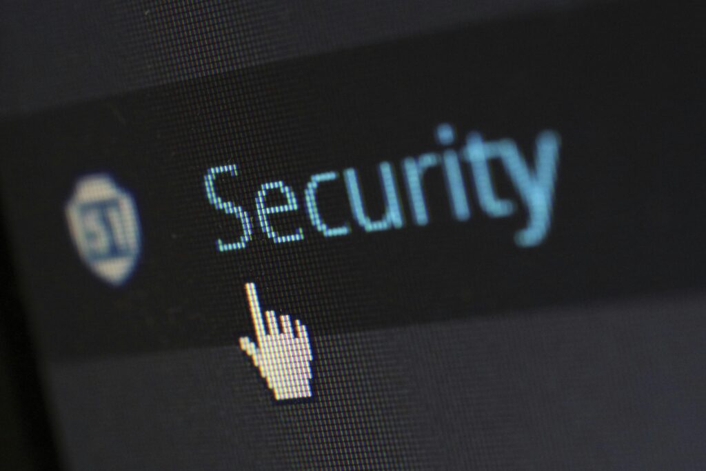 Computer screen displaying "Security" text with cursor pointer hovering over it.
