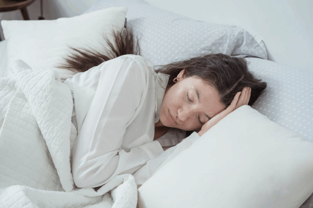 A Woman Asleep in a Bed