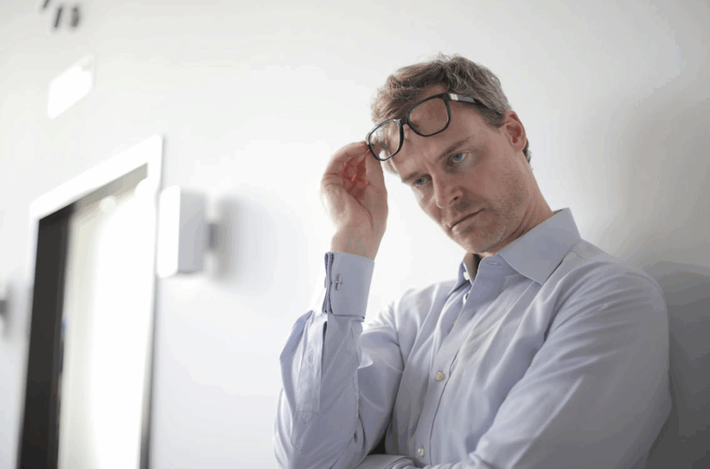 Photo Of Man Leaning On Wall