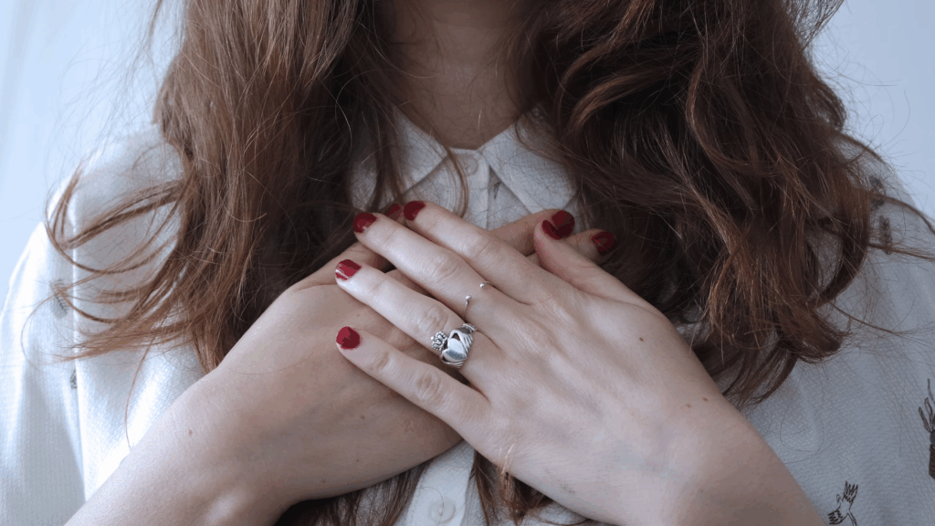 woman with nail polish and rings
