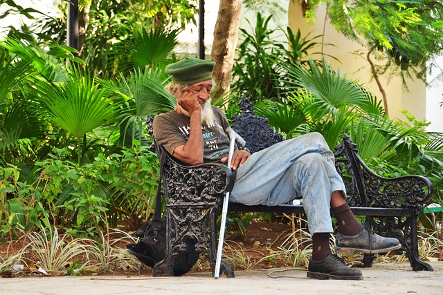 elderly man resting on a chair
