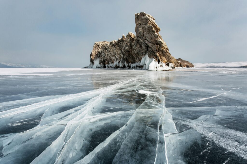 Shaman Rock at Frozen Lake Baikal in Baikal, Russia in winter