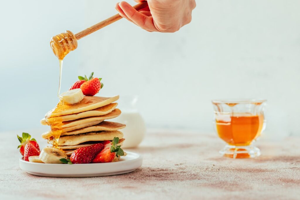 Delicious Pancakes with Honey and Fresh Fruit
